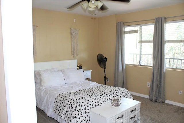 bedroom featuring baseboards, ceiling fan, and light carpet