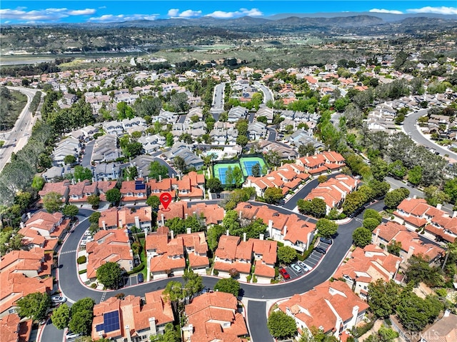 birds eye view of property with a residential view and a mountain view