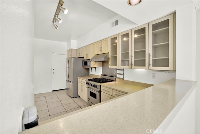 kitchen featuring visible vents, light countertops, appliances with stainless steel finishes, and under cabinet range hood