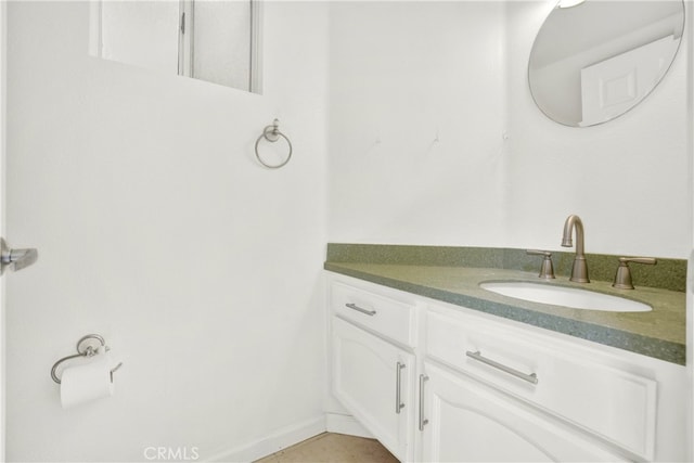 bathroom with vanity and tile patterned flooring