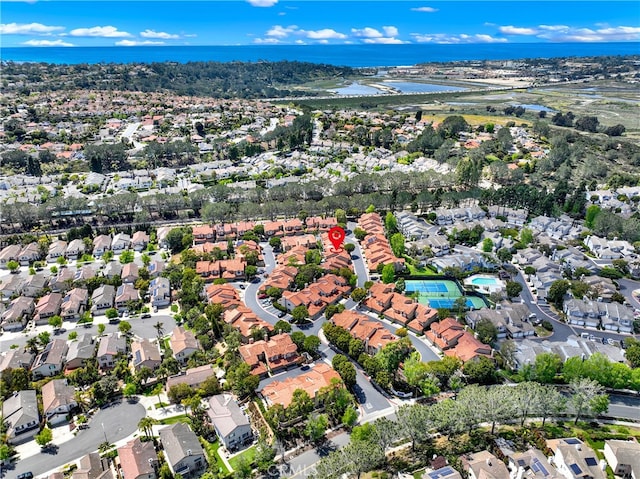 birds eye view of property featuring a water view and a residential view