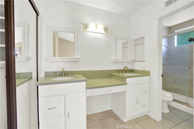 full bath with double vanity, visible vents, and a sink