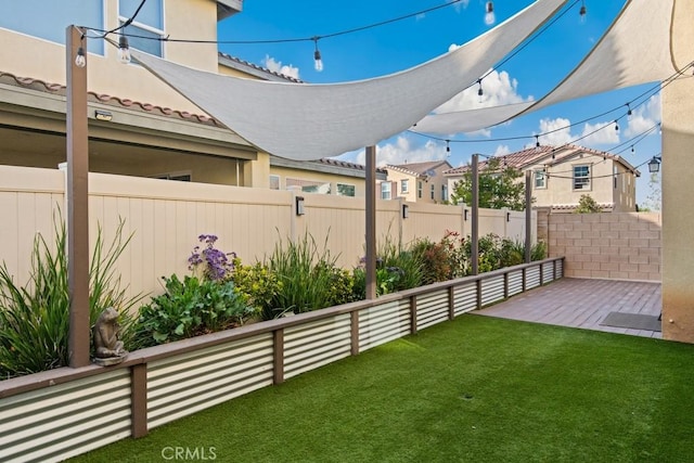 view of yard with a residential view and a fenced backyard