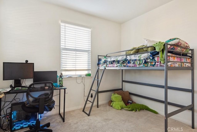 bedroom with baseboards and carpet