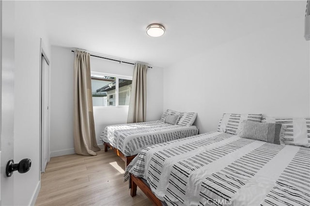 16266 Sigman St, Hacienda Heights, CA 91745 - bedroom with light wood-type flooring, baseboards, and a closet