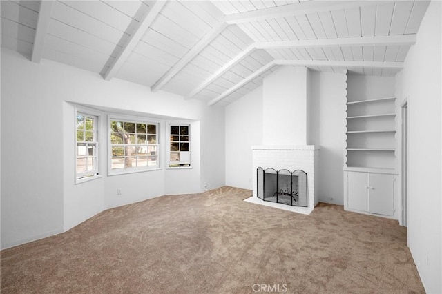 unfurnished living room with wooden ceiling, vaulted ceiling with beams, a fireplace, and carpet flooring