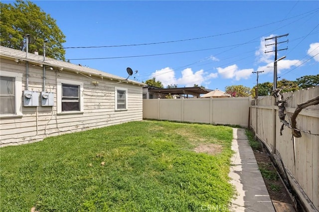 view of yard with a fenced backyard