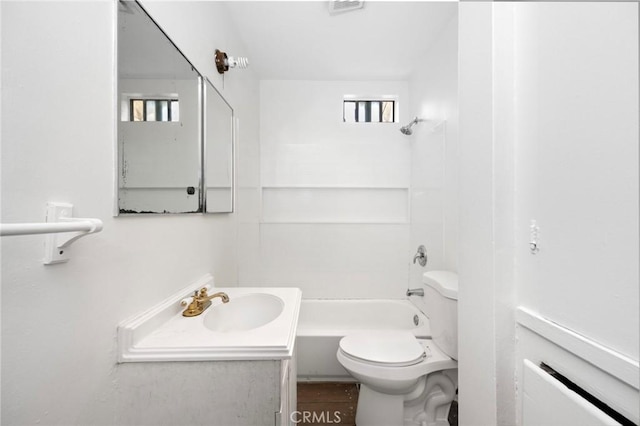 bathroom featuring vanity, tub / shower combination, visible vents, and toilet