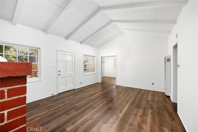 unfurnished living room with a healthy amount of sunlight, wood ceiling, vaulted ceiling with beams, and wood finished floors