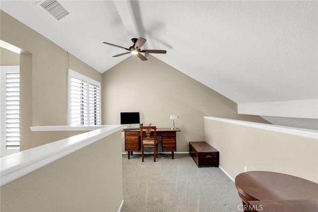 home office with a ceiling fan, visible vents, baseboards, lofted ceiling, and carpet