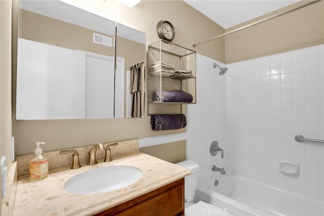 full bath featuring vanity, visible vents, bathing tub / shower combination, and toilet