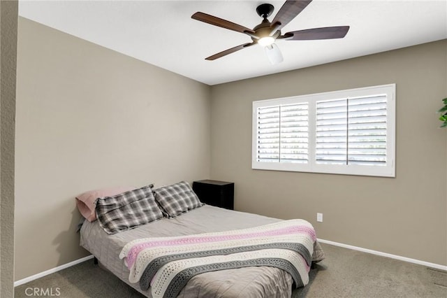 bedroom featuring a ceiling fan, baseboards, and carpet