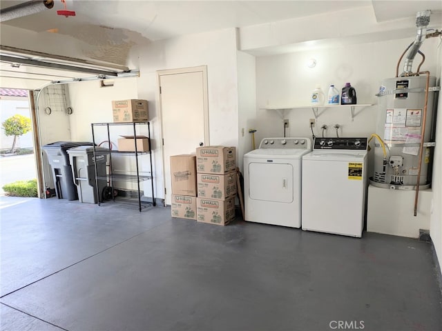 interior space with gas water heater and washing machine and clothes dryer