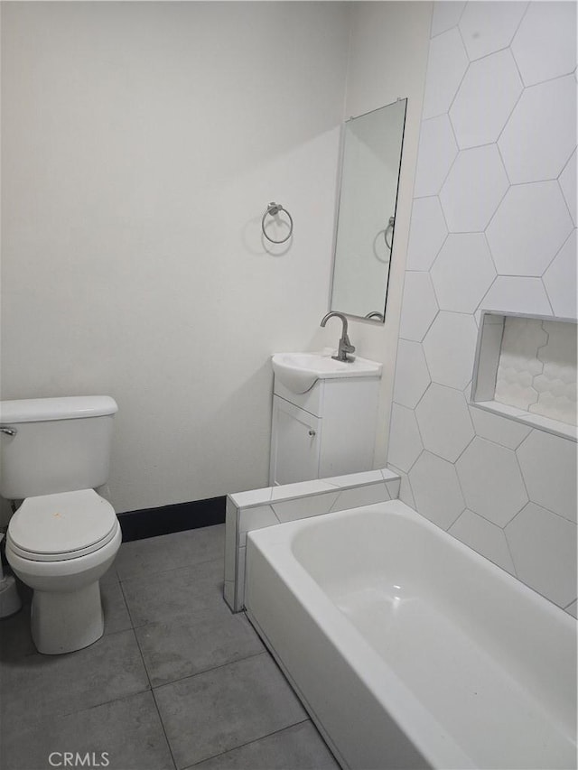 full bath with tile patterned floors, vanity, toilet, and a bathtub