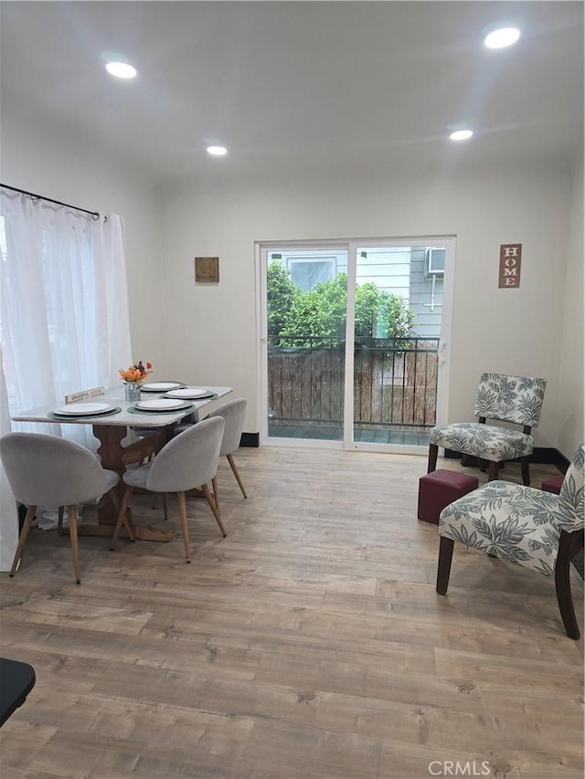 dining room with recessed lighting and wood finished floors