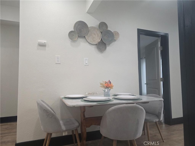 3311 E 4th St, Los Angeles, CA 90063 - dining area with wood finished floors and baseboards