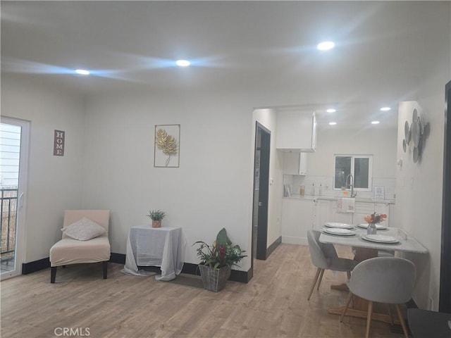 3311 E 4th St, Los Angeles, CA 90063 - living area with light wood-style floors, baseboards, and recessed lighting