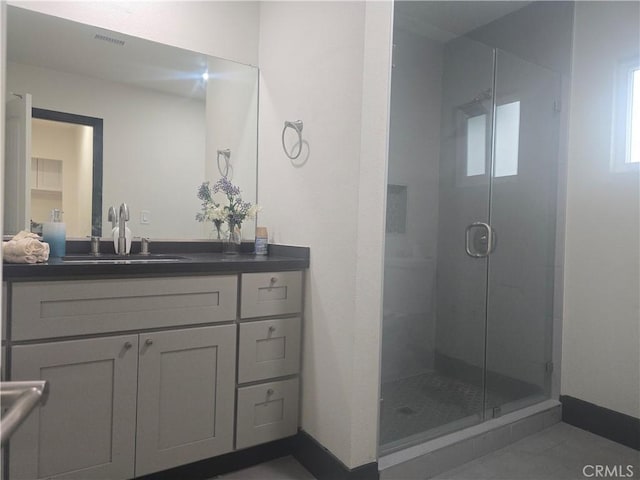 3311 E 4th St, Los Angeles, CA 90063 - full bath with a stall shower, baseboards, vanity, and visible vents