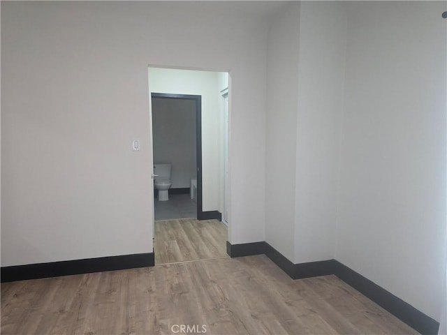 3311 E 4th St, Los Angeles, CA 90063 - unfurnished room with baseboards and wood finished floors