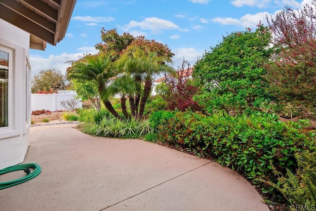 view of patio featuring fence