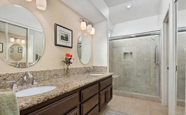4078 Lemnos Way, Oceanside, CA 92056 - full bath with tile patterned flooring, a shower stall, and double vanity