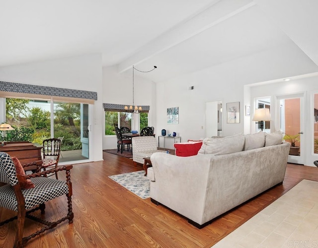 4078 Lemnos Way, Oceanside, CA 92056 - living area with high vaulted ceiling, a chandelier, beamed ceiling, wood finished floors, and french doors