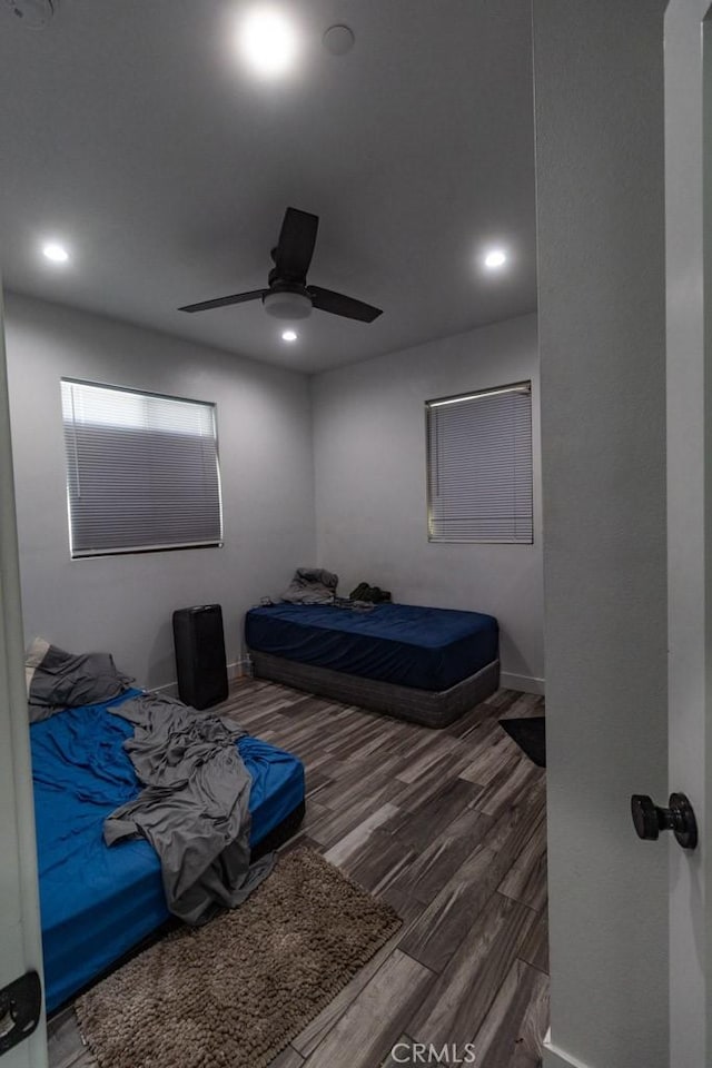 bedroom featuring a ceiling fan, recessed lighting, and wood finished floors