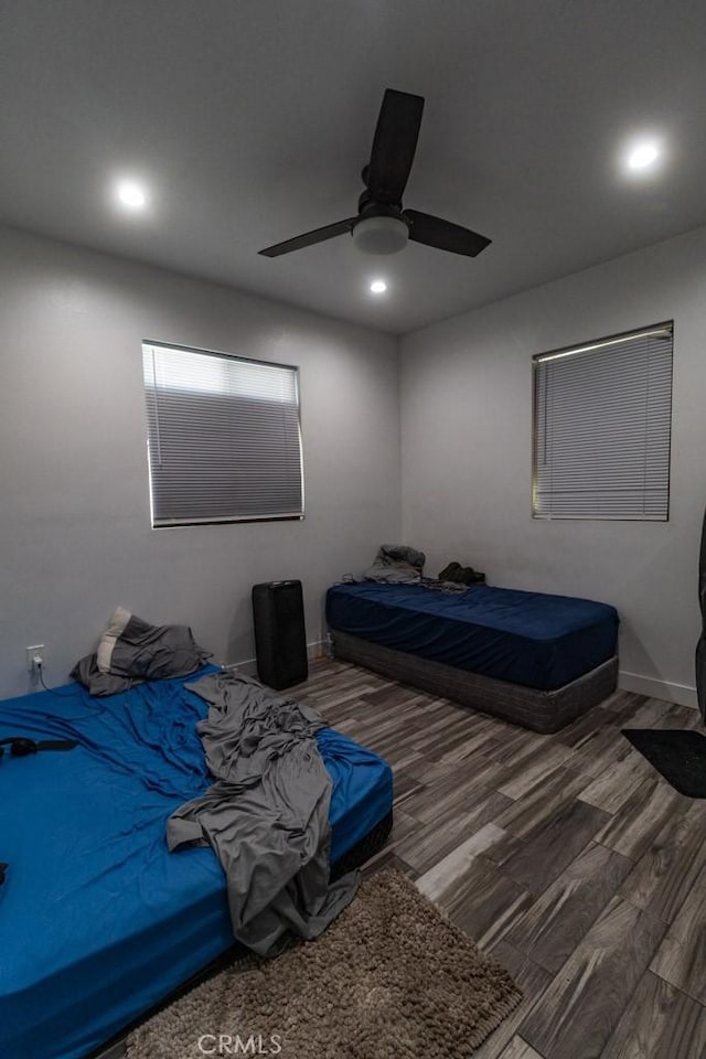 bedroom with recessed lighting, a ceiling fan, and wood finished floors