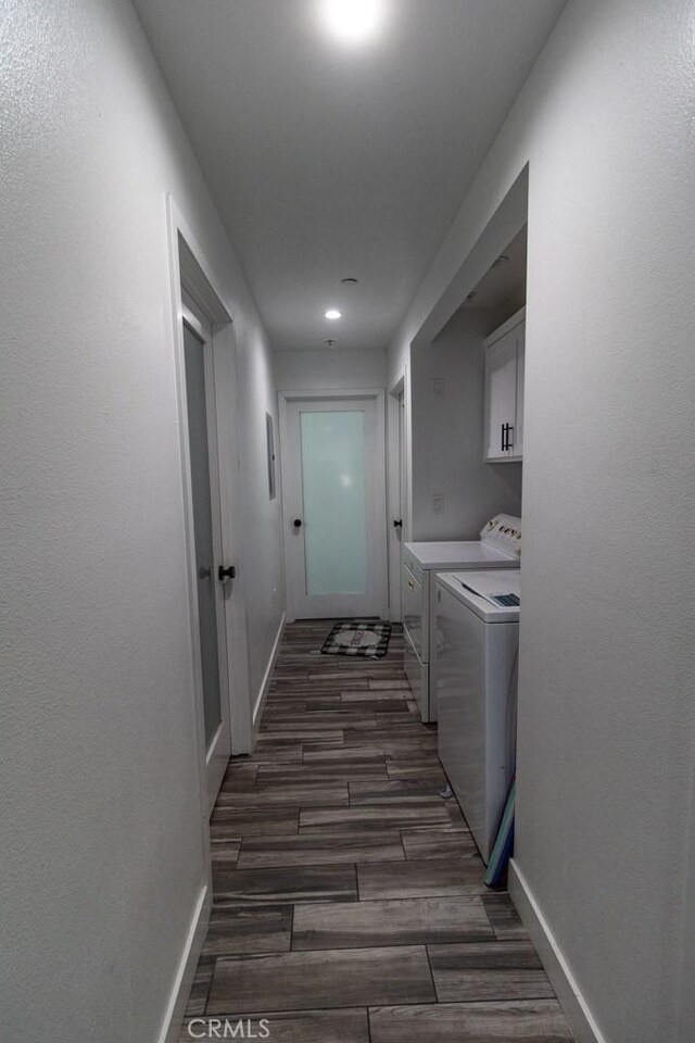 laundry room with washer and dryer, cabinet space, recessed lighting, baseboards, and dark wood-type flooring
