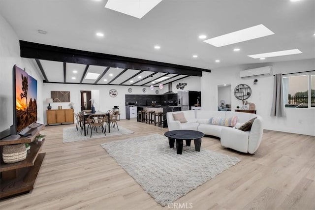 3737 Meriwether Rd Unit 29, Palms, CA 92277 - living area with beamed ceiling, an AC wall unit, a skylight, and light wood finished floors