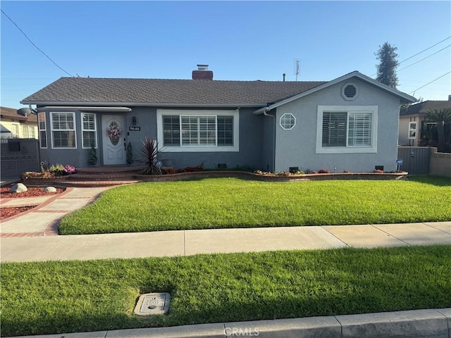 single story home with a chimney, stucco siding, a front yard, and fence