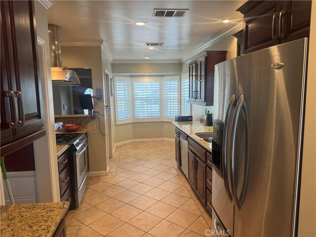 kitchen featuring light tile patterned floors, light stone counters, stainless steel appliances, and visible vents