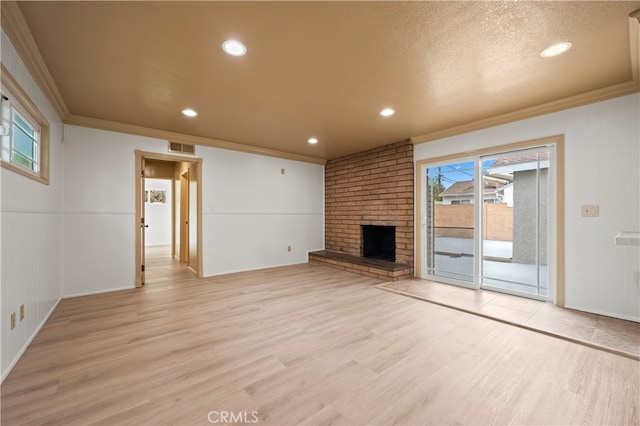 5449 E Fairbrook St, Long Beach, CA 90815 - unfurnished living room with crown molding, visible vents, and light wood-type flooring