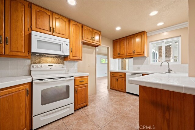 5449 E Fairbrook St, Long Beach, CA 90815 - kitchen with a sink, recessed lighting, decorative backsplash, and white appliances