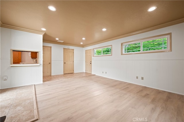 5449 E Fairbrook St, Long Beach, CA 90815 - unfurnished living room featuring crown molding, a decorative wall, recessed lighting, and light wood-style flooring