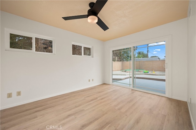 5449 E Fairbrook St, Long Beach, CA 90815 - empty room with baseboards, ceiling fan, and wood finished floors