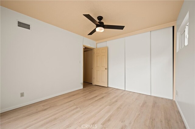 5449 E Fairbrook St, Long Beach, CA 90815 - unfurnished bedroom featuring ceiling fan, baseboards, wood finished floors, visible vents, and a closet