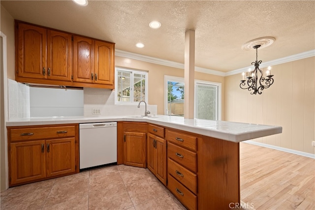 5449 E Fairbrook St, Long Beach, CA 90815 - kitchen with white dishwasher, brown cabinets, a sink, a peninsula, and ornamental molding