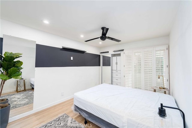 bedroom featuring recessed lighting, baseboards, ceiling fan, and wood finished floors