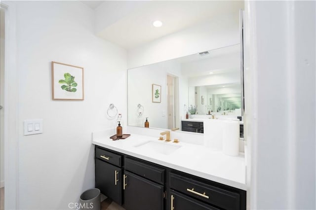 bathroom featuring visible vents and vanity