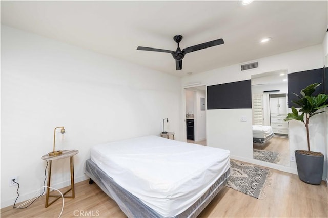 bedroom featuring visible vents, baseboards, ceiling fan, recessed lighting, and light wood-style flooring