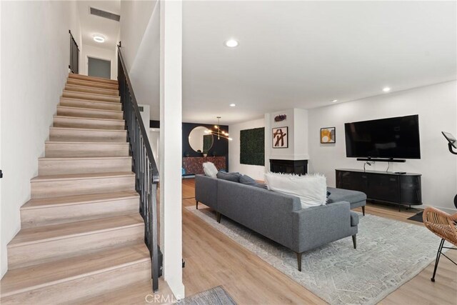 4321 Matilija Ave Unit 9, Sherman Oaks, CA 91423 - living area featuring stairway, wood finished floors, recessed lighting, and a chandelier