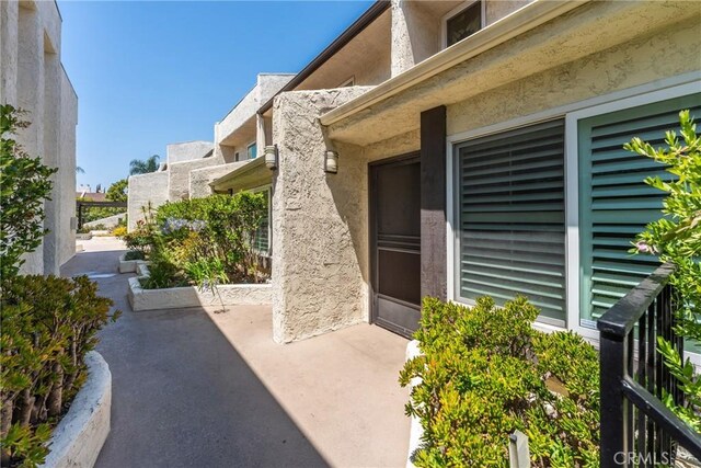 4321 Matilija Ave Unit 9, Sherman Oaks, CA 91423 - entrance to property featuring a patio and stucco siding