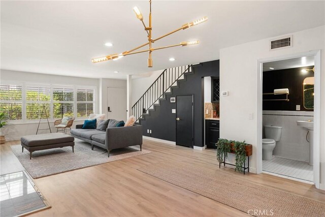 4321 Matilija Ave Unit 9, Sherman Oaks, CA 91423 - living area featuring a chandelier, light wood-style flooring, stairs, recessed lighting, and bar