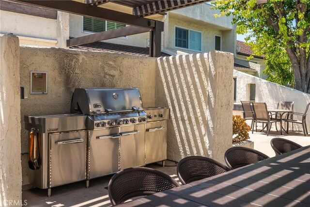4321 Matilija Ave Unit 9, Sherman Oaks, CA 91423 - view of patio / terrace featuring outdoor dining space, area for grilling, and a pergola