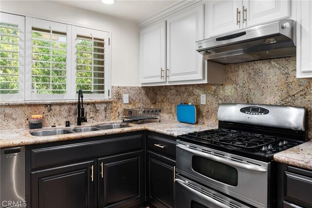 4321 Matilija Ave Unit 9, Sherman Oaks, CA 91423 - kitchen with stainless steel appliances, under cabinet range hood, white cabinetry, and dark cabinetry