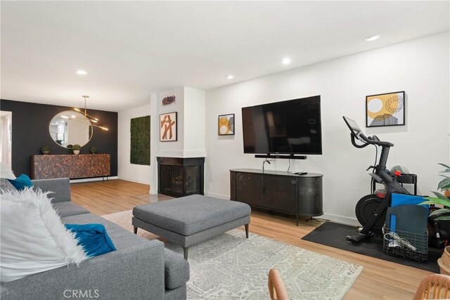 4321 Matilija Ave Unit 9, Sherman Oaks, CA 91423 - living area featuring wood finished floors, recessed lighting, and a multi sided fireplace