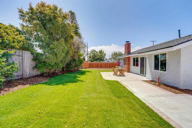 view of yard featuring a fenced backyard and a patio area