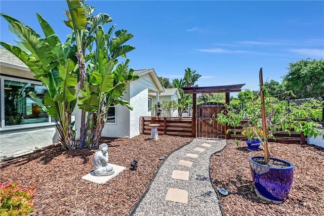 view of yard with fence and a gate