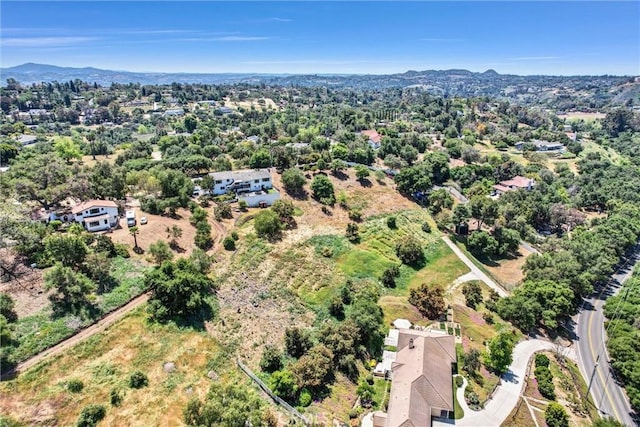 drone / aerial view featuring a mountain view